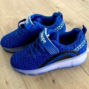 Tennis shoes with wheel.